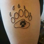 This is a tattoo my husband and I got. His has the bear paw filled in.