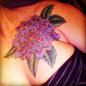 This is a cover up of a wanna be sunflower I hid for 16 yrs.I would love some scetches of flowers from The Great Northwest added to this piece up and over shoulder with ending in a partial sleeve down my arm I'm wanting to love it and I'm not.Any ideas? Deffinatly need more work.