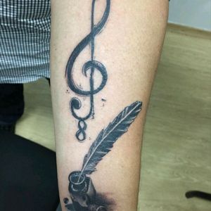 @licotattoo made this tattoo for me. He is an outstanding brazilian artist, with whom I intend to do more two. The octave clef refers to my tenor classification in my choir. The feather and ink are about my passion for poetry and literature.