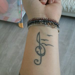 #s #sing #tattoo #trebleclef #backtofront