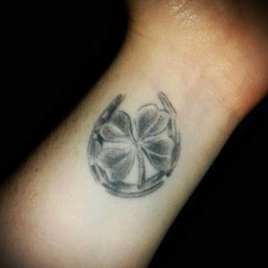 My first ever tattoo when I was 18. People ALWAYS ask me what it is! It's a four leaf clover inside a horse shoe. It's not what I originally wanted and I regretted it afterwards, but I've now learnt to love it, I might get some colour added to it one day.