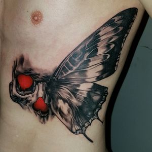New tattoo by @pawel_stroinski on my ribs #tattoo #skull #butterfly #ribs #red #blackandgrey