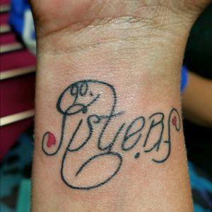 Bestie tattoo celebrating 10 years. Reads sisters, turn it upside and it reads friends.  Got it done by a talented artist in Oranjestad,  Aruba.