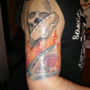 Rock skull and Secund tatoo, shark in sea on flames inspired by the movie (the shalhows ) by Tiago siez (alto astral) #shark #flames #skull #guitar #realism #fresh