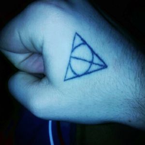 Deathly Hollows from Harry Potter. I got this as one of my first tattoos as a tribute to my best friend I unfortunately lost 2 years ago. Plan on adding on to it