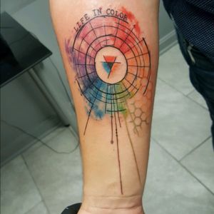Watercolor color wheel tattoo.