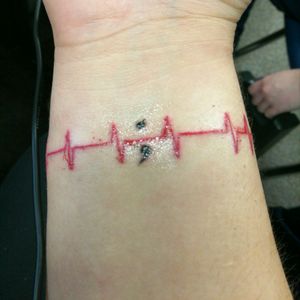 Just got this on 2/5/17. The heart beat is my heart beat taken on a ekg. This is my first tattoo.