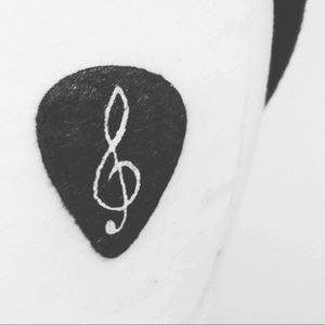In love ❤ #guitar #guitarpick #tattoo #simple #musictattoo #music #trebleclef #blackandwhite #ribtattoo
