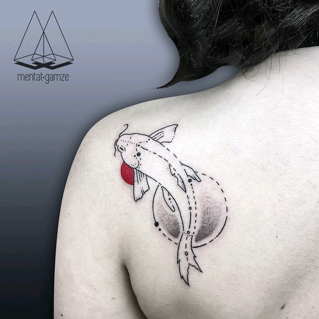 Floral and skeleton fish tattoo located on the inner