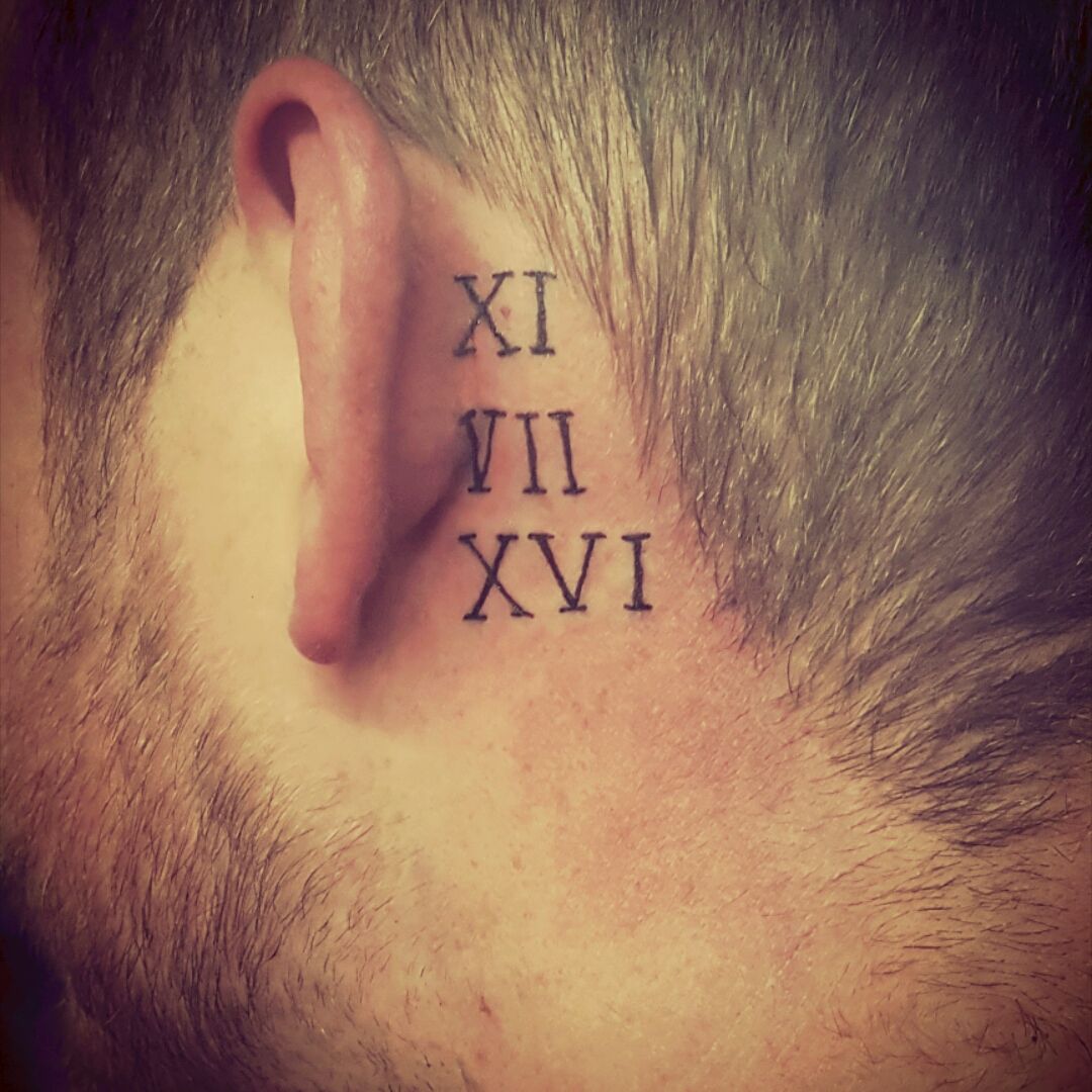 Beautiful Roman Numeral Five And Two Tattoo On Behind Ear
