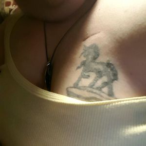 Unicorn on top of left breast, port underneath it.
