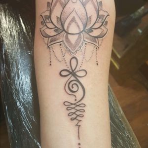 My latest tattoo A unilome. The squiggles indicate the struggles in live, but finding the straight line /path I have found. The lotus is enlightenment. And the middle symbol is a celtic symbol for strength. Love it