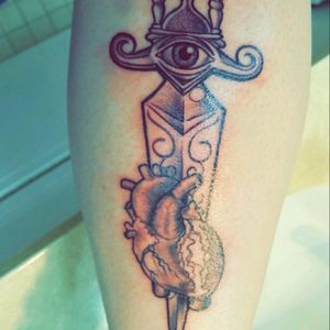 My newest tattoo on lower right calf. Unable to load the whole thing.  #dagger  with #hourglass & #eye going through #heart