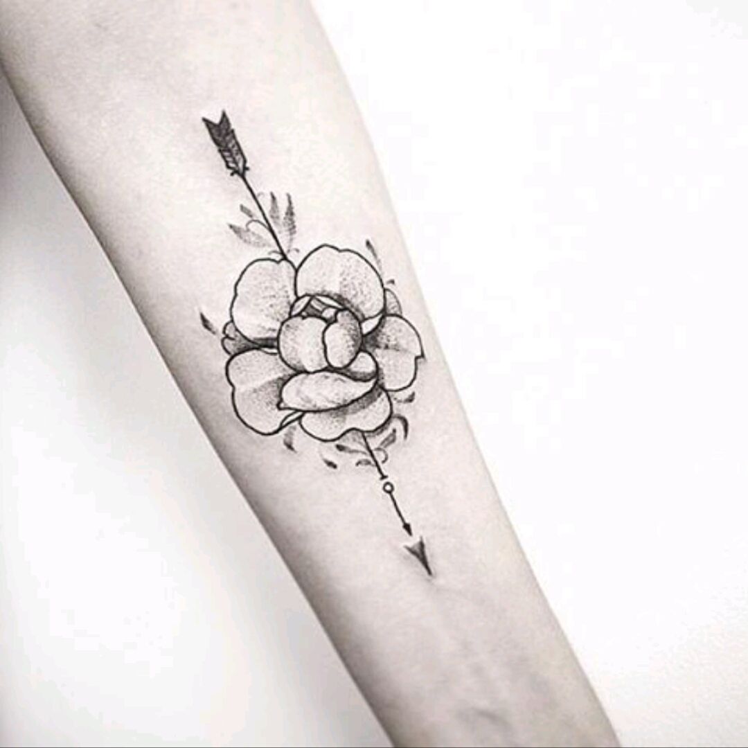 Tattoo heart pierced by arrow with ribbon and rose