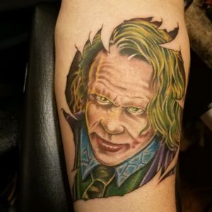 My joker tattoo. The Joker coming out of my arm.