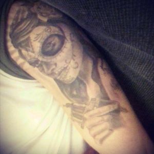 This is my tattoo of santa muerte done by John selly at glow tattoo studio in mid wales, this is it fully healed but in terrible lighting