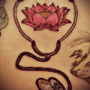Can't really see the whole thing. Stethoscope with the Star of Life on the bell. That is a lotus flower in the middle, to signify new beginnings. 14th tattoo.