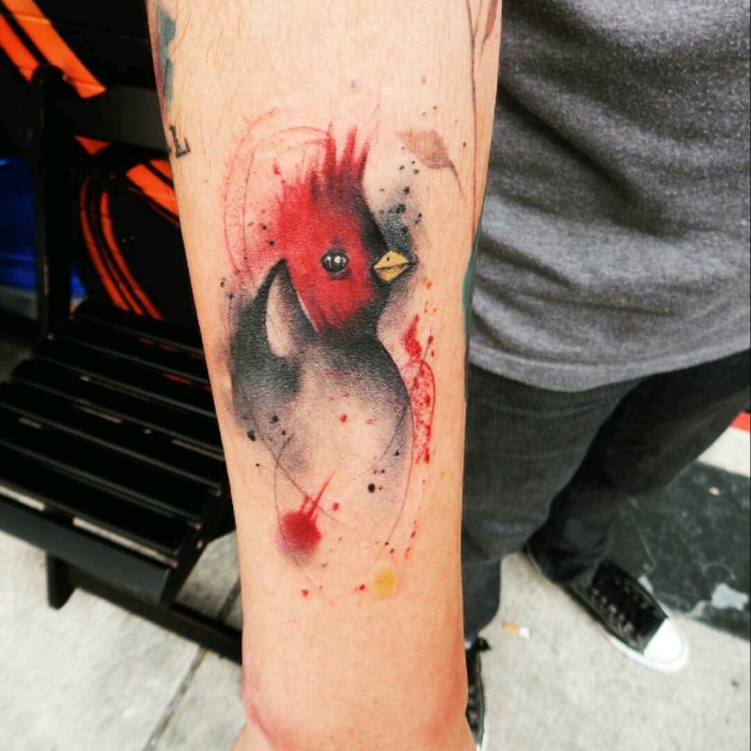 Watercolor cardinal tattoo on the left thigh