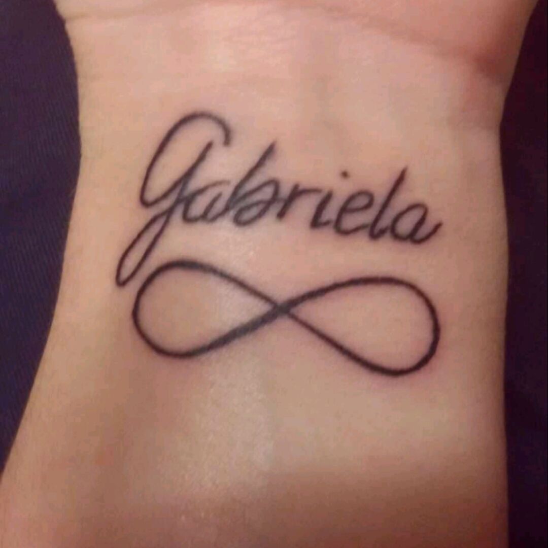 Tattoo uploaded by Mariana Dias • #name #gabriela #infinity #cocotattoogeneve #mytattoo #lovebymother #lovemytattoo #portuguese • Tattoodo
