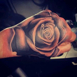 Black and grey realistic rose hand tattoo a did a while ago