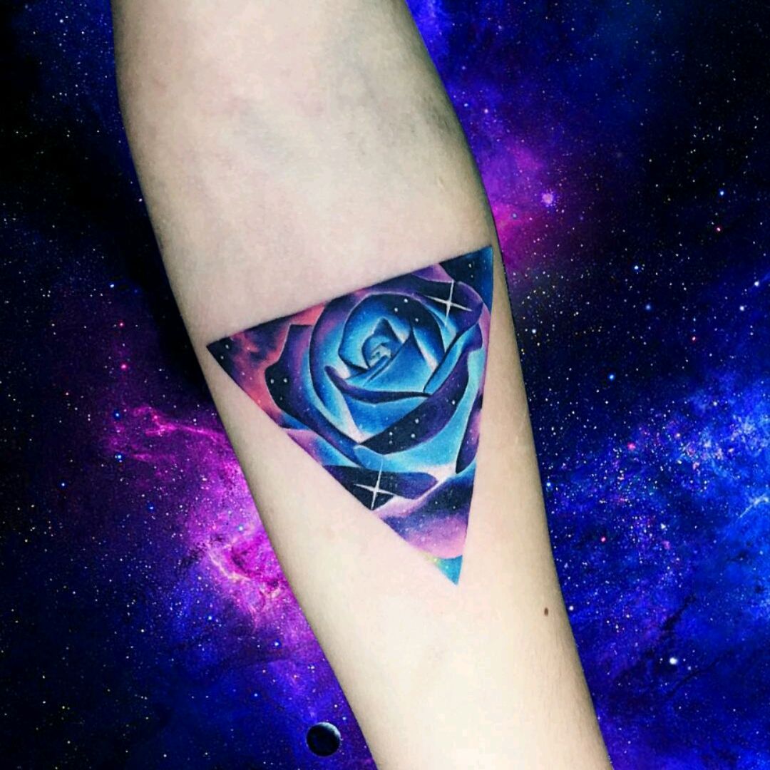 Upper back tattoo of a realistic galactic rose