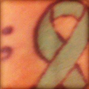 Teal ribbon stands for military sexual trama. With the semi colon which stands for life almost ending hard time n maken it through