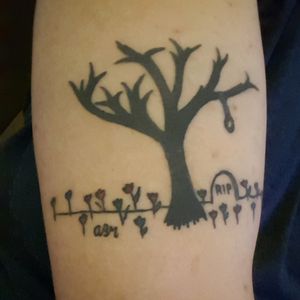 This is my latest!! My oldest daughter, Aelish, drew this on a sketch pad when they were at my apt. It's a dead tree, with a noose, over a tombstone, in a field of tulips!!I loved it, and it was an easy decision to make it part of me forever!!