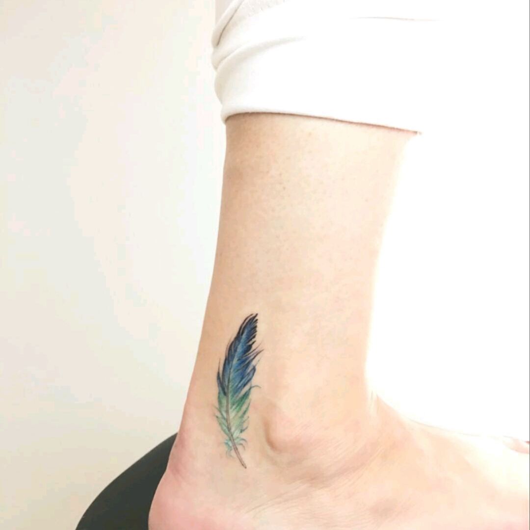 Delicate feather tattoo  Feather tattoos Feather tattoo design Feather  tattoo wrist