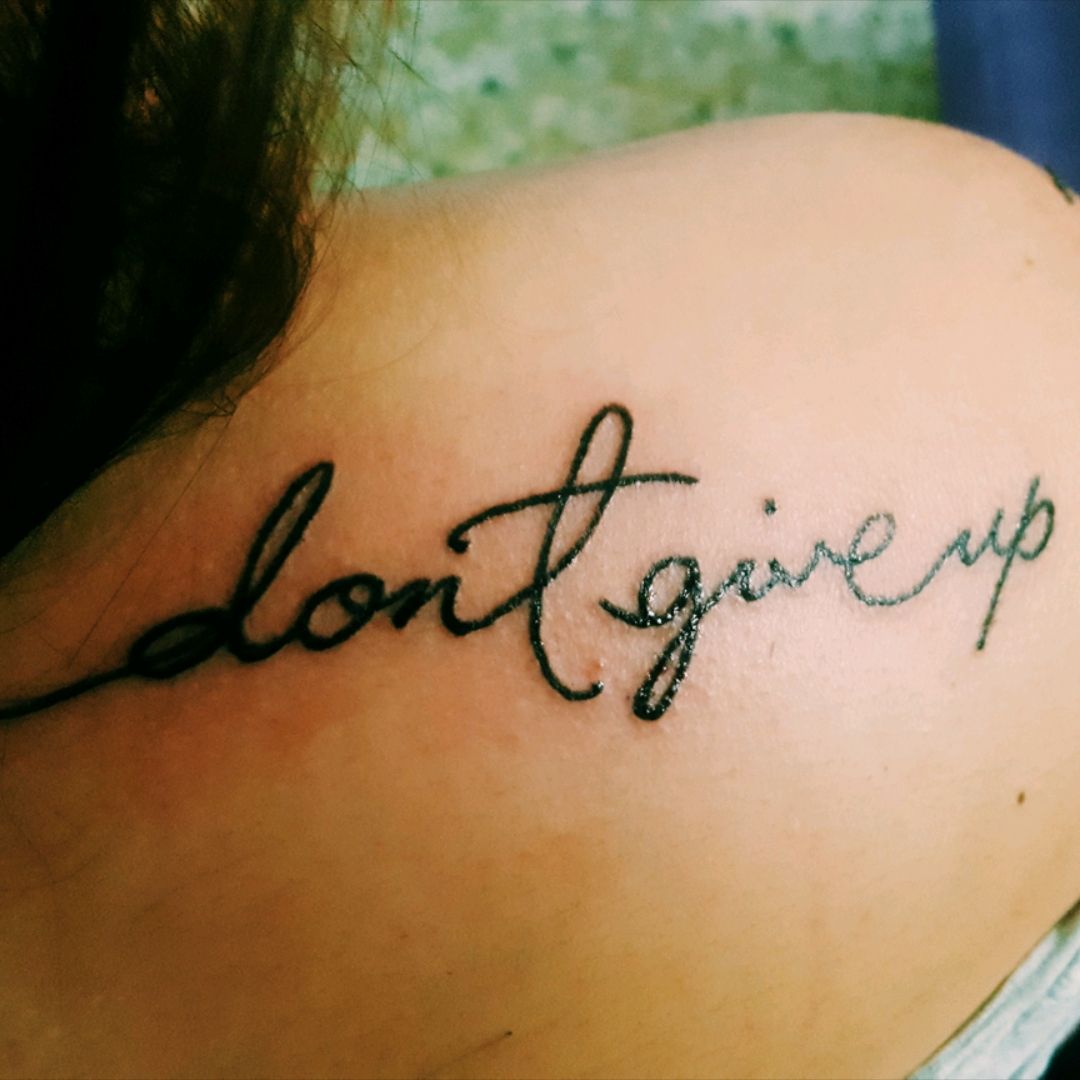Tattoo uploaded by Kayzee Fernandez • 4th #dontgiveup #text #quotes #script  #saying #reminder #letters #handwritten #upper #back • Tattoodo