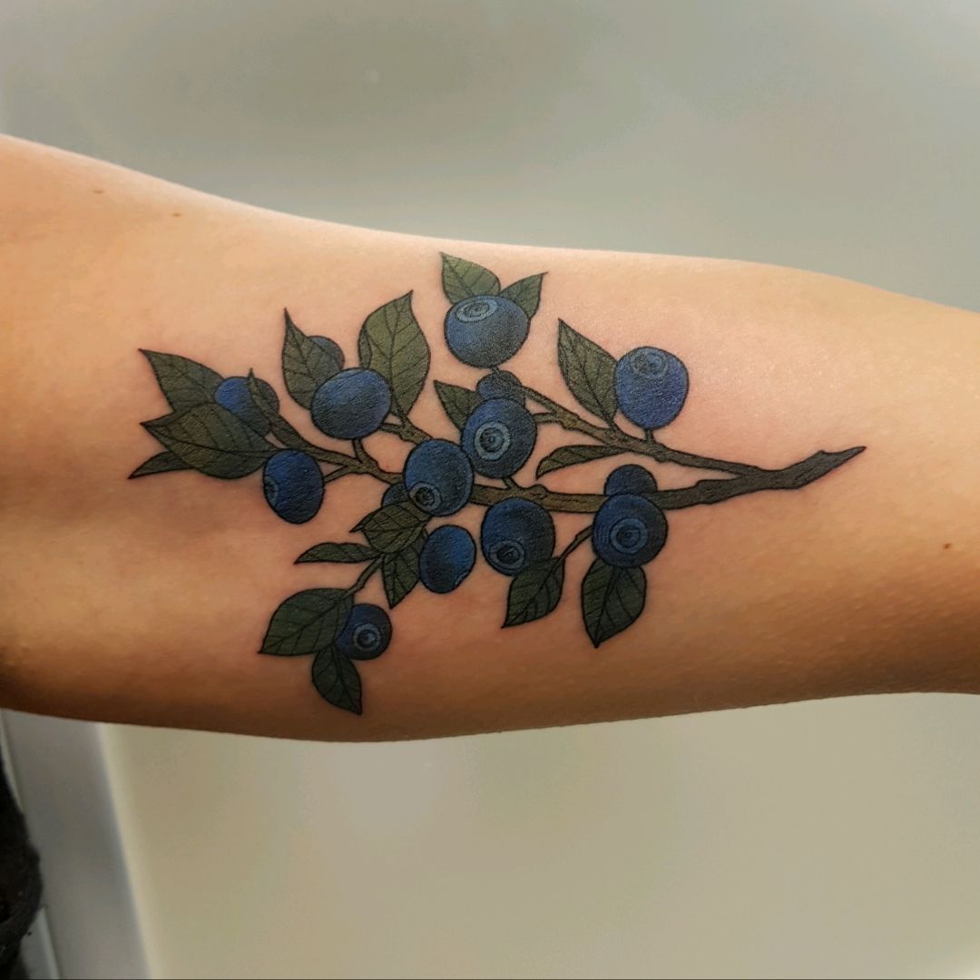 These Montana tattoos feature huckleberries Bitterroot and paintbrush