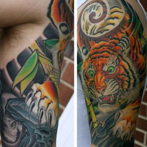 Angry tiger with a side of skull rocks