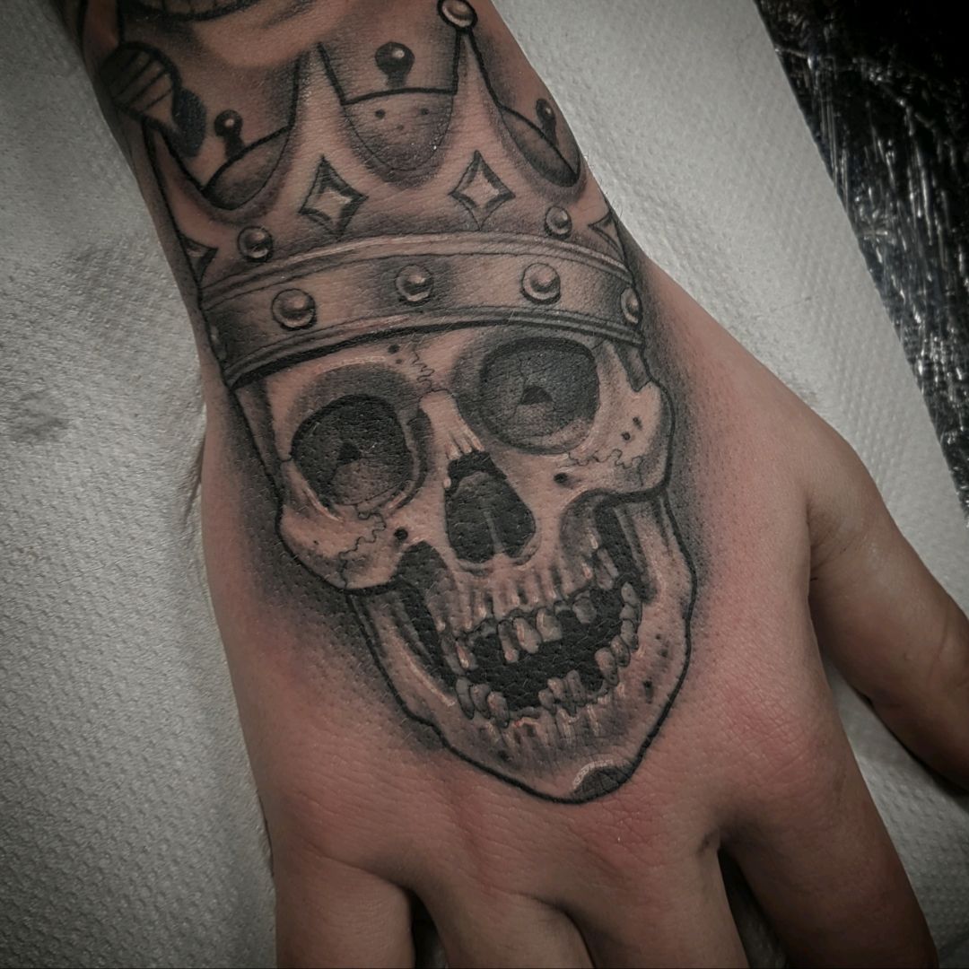 Enthralling Man With Smiling Skull And Crown Tattoo On Hands Lucky Charm  New Me  Tattoos Pictures  Crown hand tattoo Hand tattoos for guys  Tattoos for guys