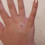 It is a very little stick 'n poke dot. It seems a mole, but it covers a scar that I had because of my ex boyfriend. It is my dot, that ends the past, and makes me start a new sentence.#sticknpoke #sticknpokelove  #dot #black #handtattoo #small #mole #scars #scar #scarcoverup #scarcovering