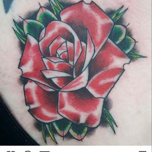Rose on chest.