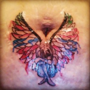 The wings mean my lost son, and the girl represents me... The colors are all the different emotions he brought to me, happiness, sadness, strength, and love ;) RIP Isaac Aguilar