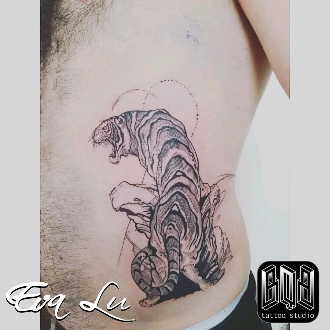 Tattoo uploaded by BQB • Fine-line tiger on tthe ribbs by Eva Lu • Tattoodo