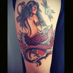 Mermaid sitting on an anchor . Oldschool tattoo done by Yauhen Abu at Azazel Warsaw Poland #mermaid #anchor #sailor #oldschool