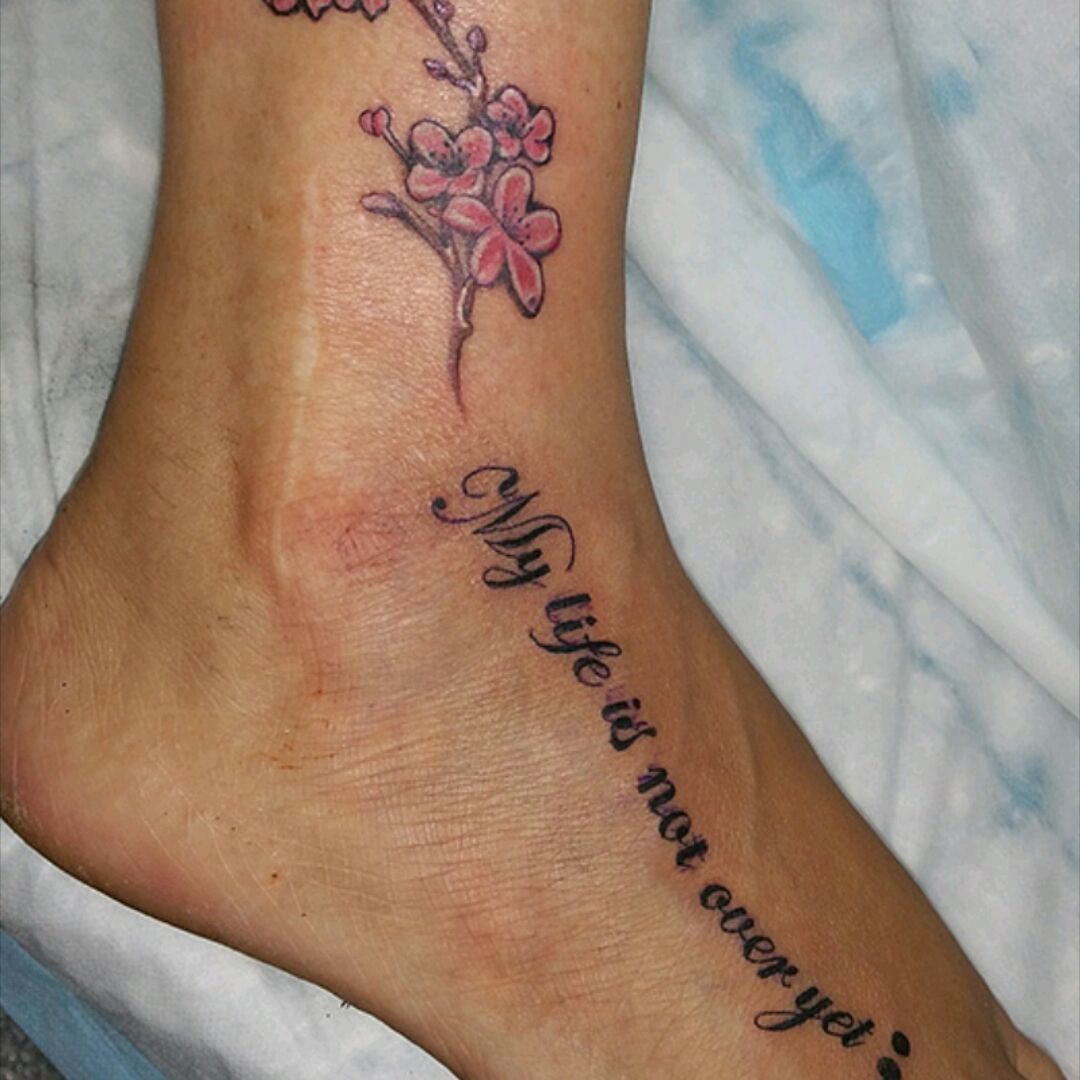 Tattoo uploaded by Steven D'Alton • Never give up! #depressionawareness  #cherryblossomtattoo #letteringtattoo • Tattoodo