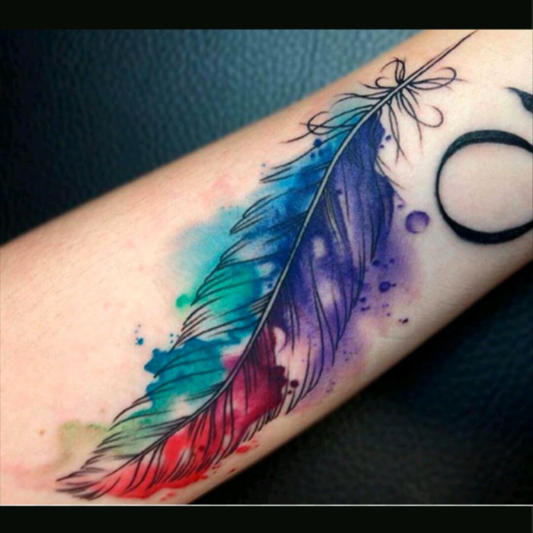 colorful feather tattoo on side
