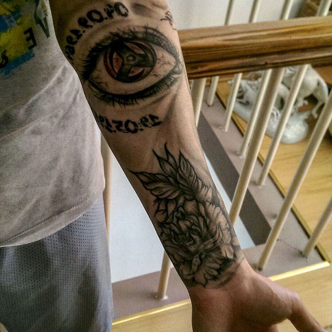 sharingan arm tattoo