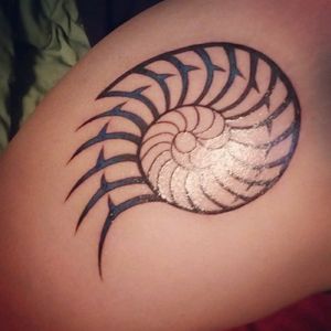Tribal/Polynesian Nautilus Tattoo with Black and Blue Ink. Done by Jason Morrow at Big Brain in Omaha, Nebraska