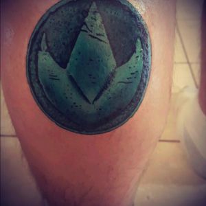 My first tattoo and it's the green power ranger's power coin. By James Michael Ray Boyd (IG-jamesdoestattoos) #newschool #PowerRangers