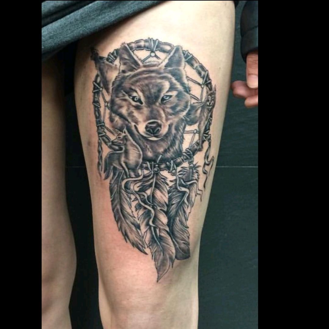 Tattoo uploaded by Lucy Mattock • Wolf dreamcatcher tattoo #wolf  #dreamcatcher #thigh #largepiece #feathers #feminine #tattoo • Tattoodo