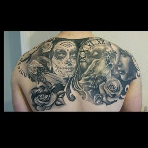 Black and Grey back piece. Done by Karl Stevens of White Flame Tattoo Studio. #blackandgrey #backpiece #wolf #dayofthedead #crow #whiteflamestudio