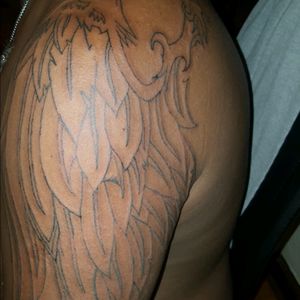 My First Tattoo, showing my Angel's Wing. Putting my guardians names on the feathers