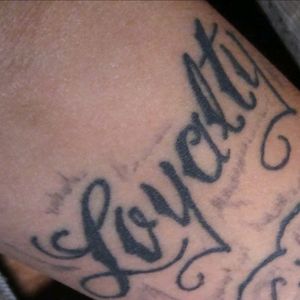 Loyalty (upper forearm tattoo)