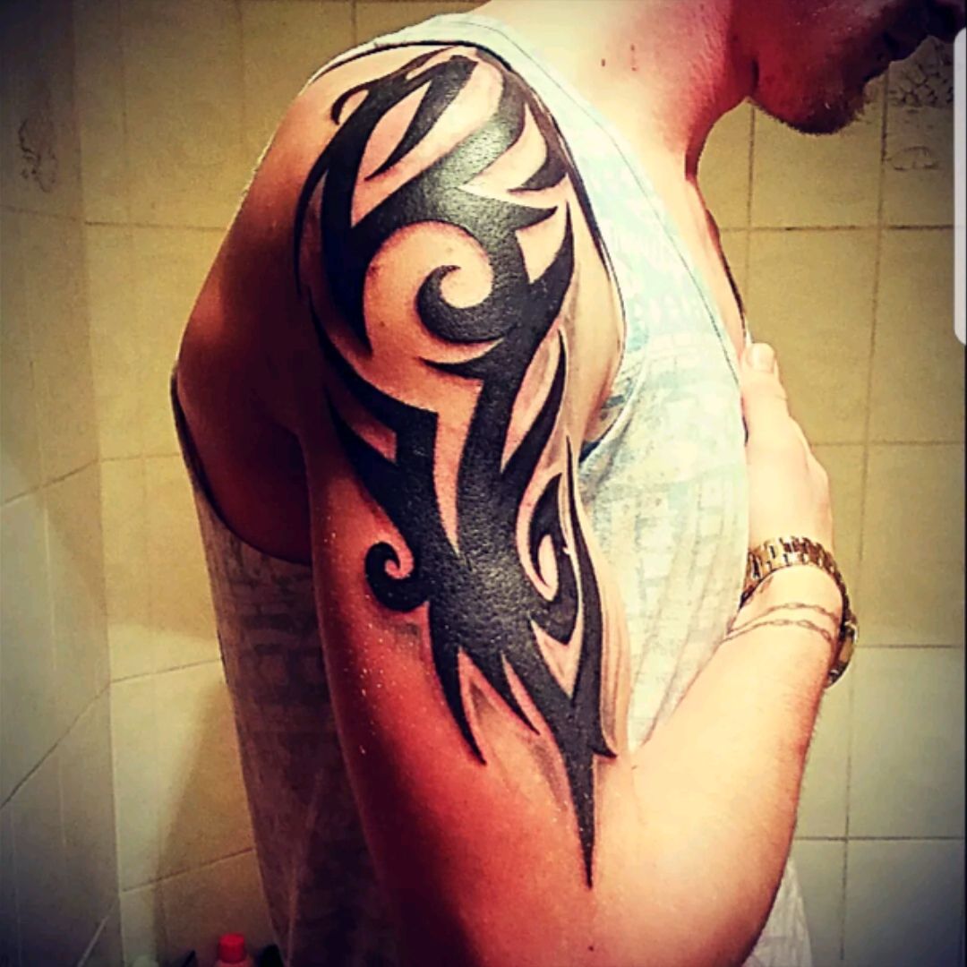 tribal upper arm tattoo