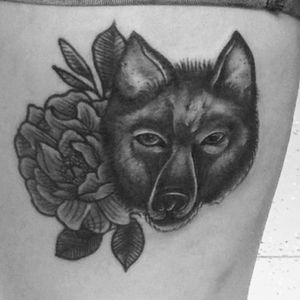 My 2nd tattoo that had to get redone. Its a wolf