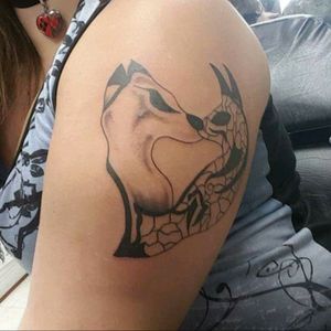 This tattoo is based off one of my drawings. Its my take on tribal wolves.