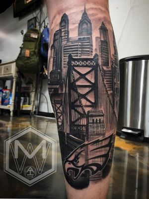 Philadelphia Eagles themed tattoo by Mike Woods. Benjamin Franklin Bridge overlooking Philadelphia's skyline. #Philadelphia #Eagles #skyline #bridge #BenjaminFranklin 
